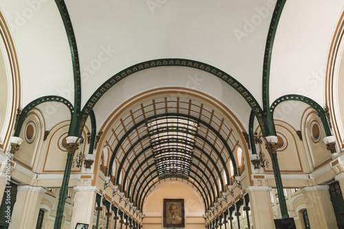 Inside Saigon Central Post Office with photo of Ho Chi Minh