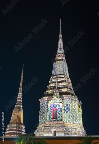 Stupas of Wat Phra Chetupon Vimolmangklararm at night, Bangkok, Thailand. photo