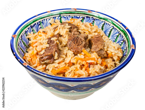side view of plov in traditional ceramic bowl
