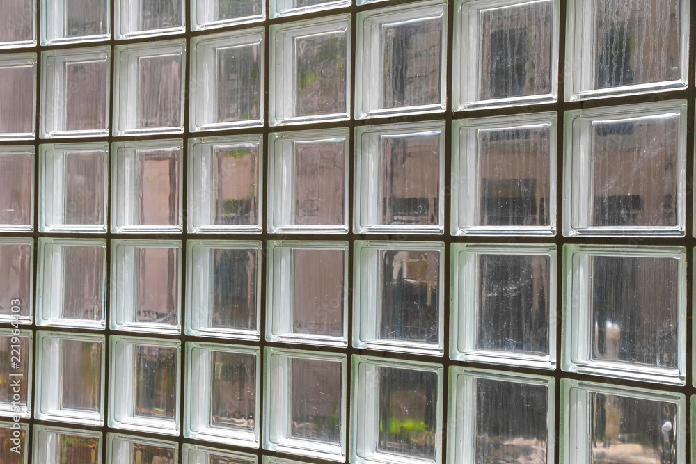 Closeup view on a wall made of glass tiles. Closeup view on a wall made of glass tiles.