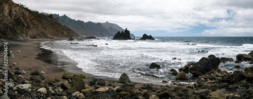 Panoramic view of Benijo beach with big waves, black sand and rocks on the north coast of the island Tenerife, Spain