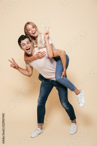 Full length portrait of a cheerful young couple