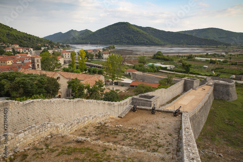 View of Ston town and its defensive walls, Peljesac Peninsula, Croatia. Ston was a major fort of the Ragusan Republic. photo