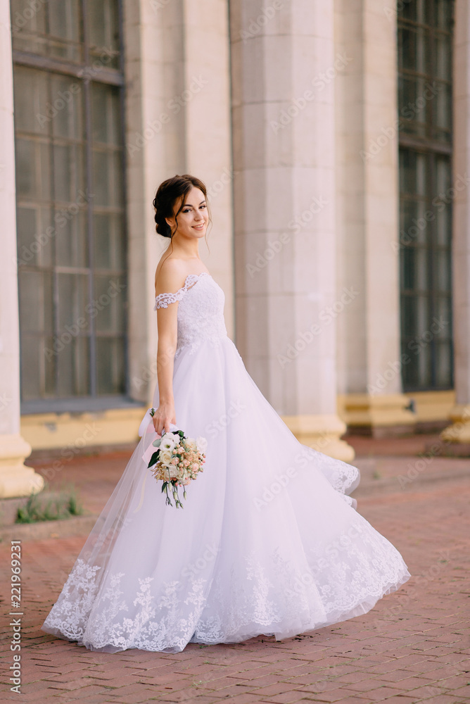 portrait of young bride near columns portrait of young bride near columns
