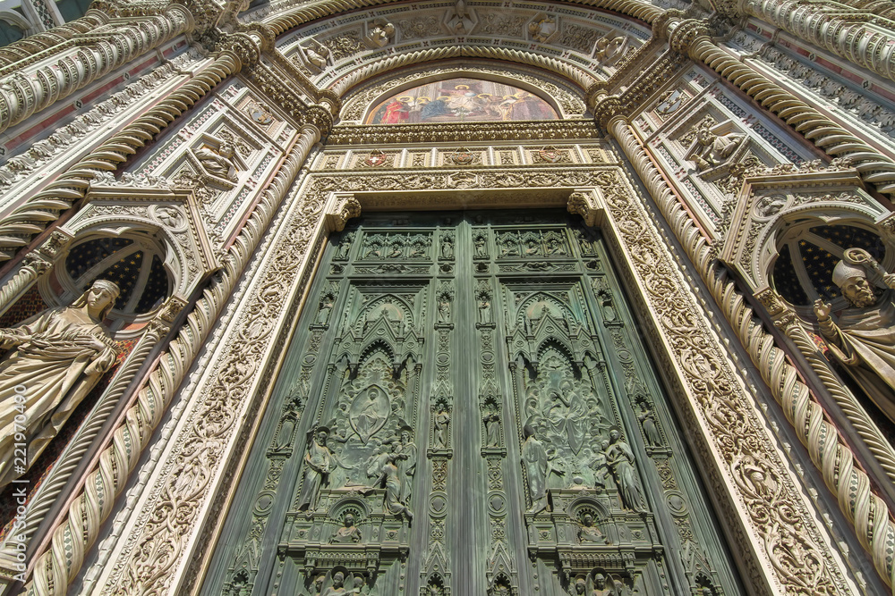 View on the main entrence of the Cathedral of Santa Maria in Florence, Italy on a sunny day.