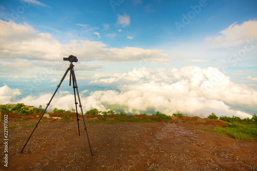 Dslr digital professional camera stand on tripod photographing mountain, Blue sky and cloud landscape. nature background.image,picture on screen.dslr camera shoting nature landscape.camera on a tripod