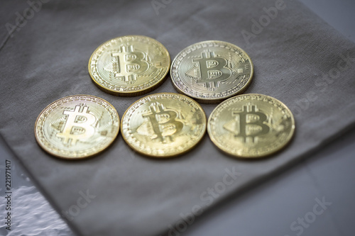A batch of Digital Currency physical gold Bitcoin on a sack