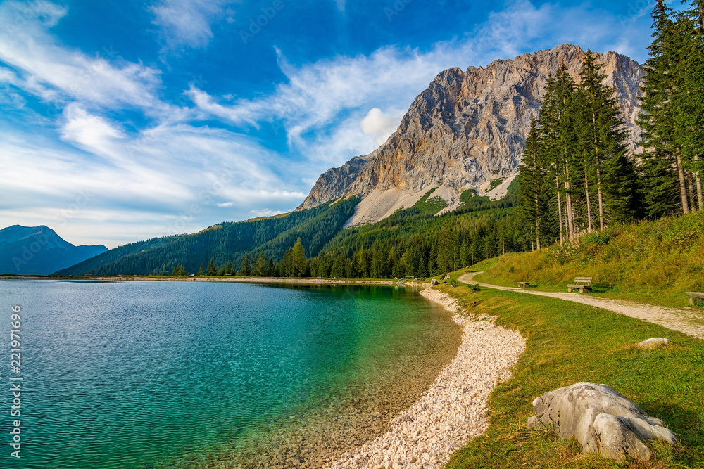 A beautiful view on the Ehrwalder Almsee and the Zugspitze on a sunny summer day in Austria, September 2018