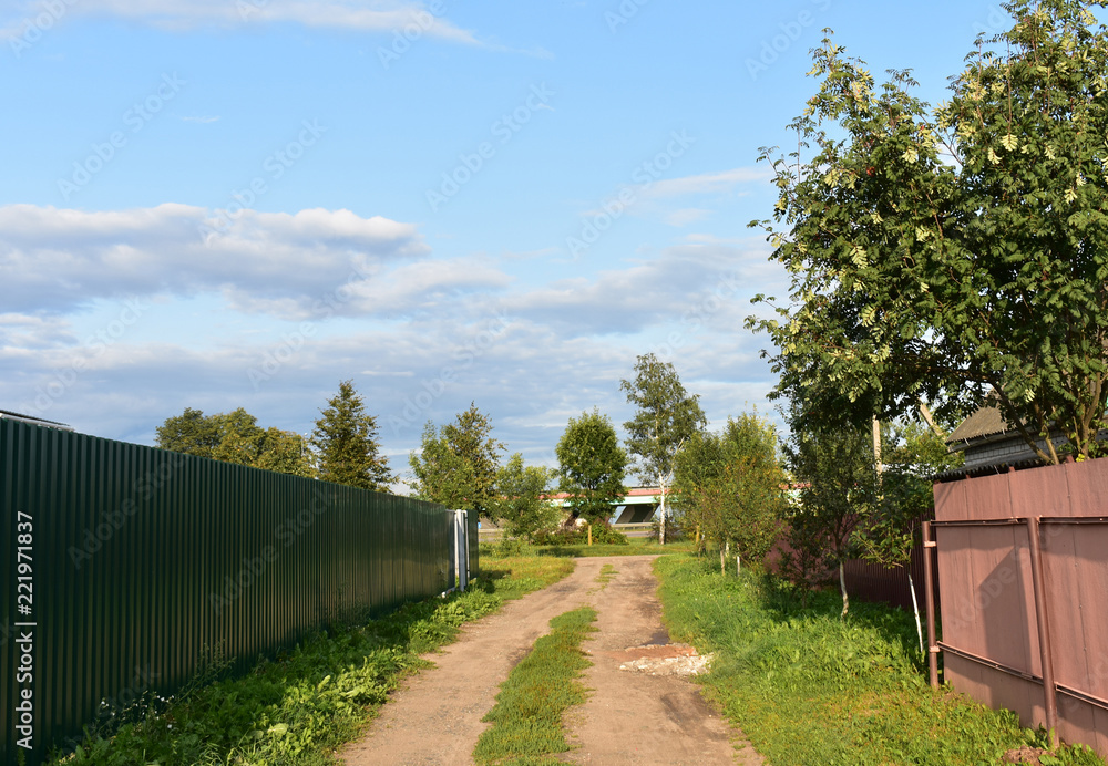 A country road along the fences A country road along the fences