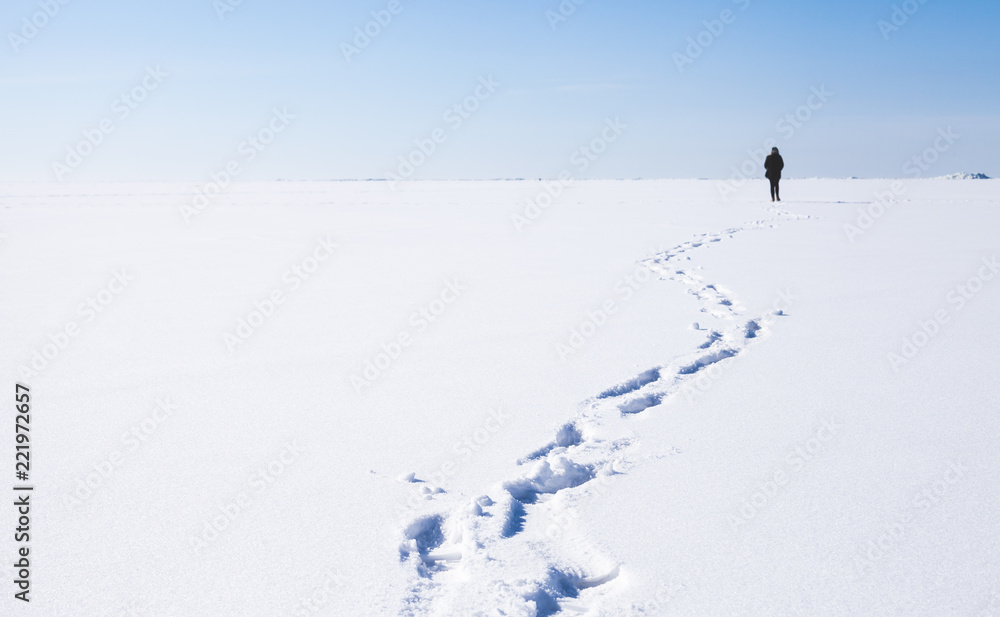 Footsteps of lonely person walking on snow Footsteps of lonely person walking on snow