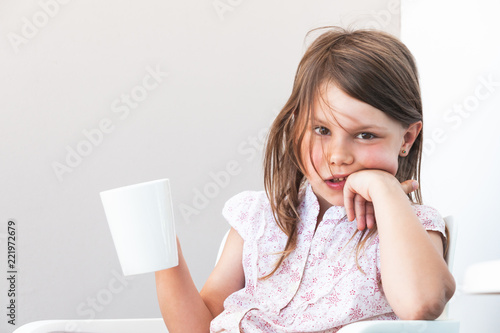 Portrait of little girl with cup of hot chocolate