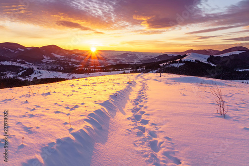 Winter sunrise in the hills mountains.