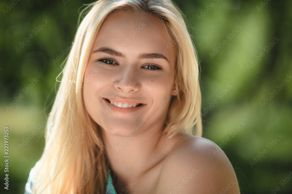 Close up portrait of sweet blonde woman. Attractive female with sweet gorgeous smile looking directly into camera and grining. Close up portrait of sweet blonde woman. Attractive female with sweet gorgeous smile looking directly into camera and grining.