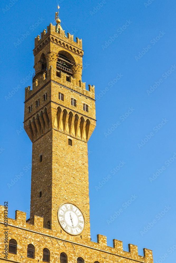 View on the old palace called Palazzo Vecchio in Florence, Italy on a sunny day.