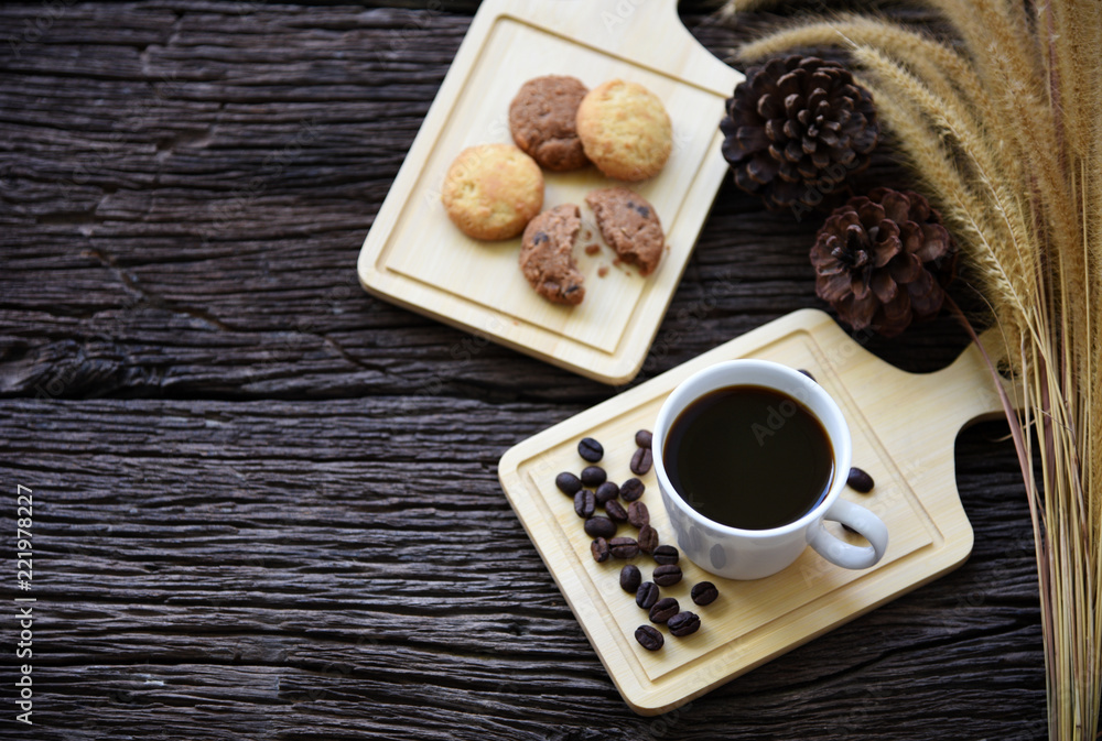 black coffee and cookie on wooden table black coffee and cookie on wooden table
