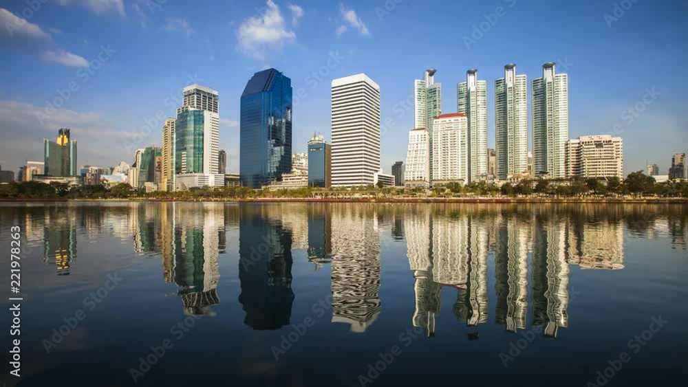 BANGKOK,THAILAND - APRIL 14, 2018 : Photo of modern building in business area of Bangkok,Thailand under clear sky on water reflection BANGKOK,THAILAND - APRIL 14, 2018 : Photo of modern building in business area of Bangkok,Thailand under clear sky on water reflection