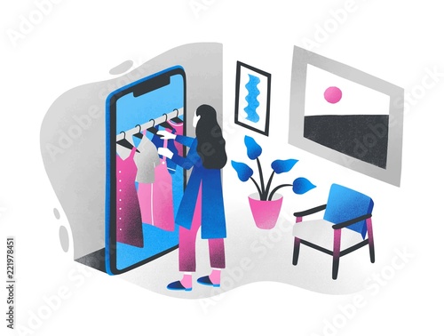 Woman standing in front of giant smartphone and choosing clothes hanging on h...