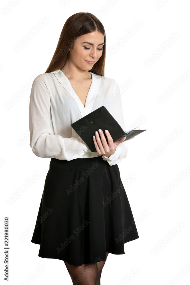 Beautiful woman with notebook on white background Beautiful woman with notebook on white background