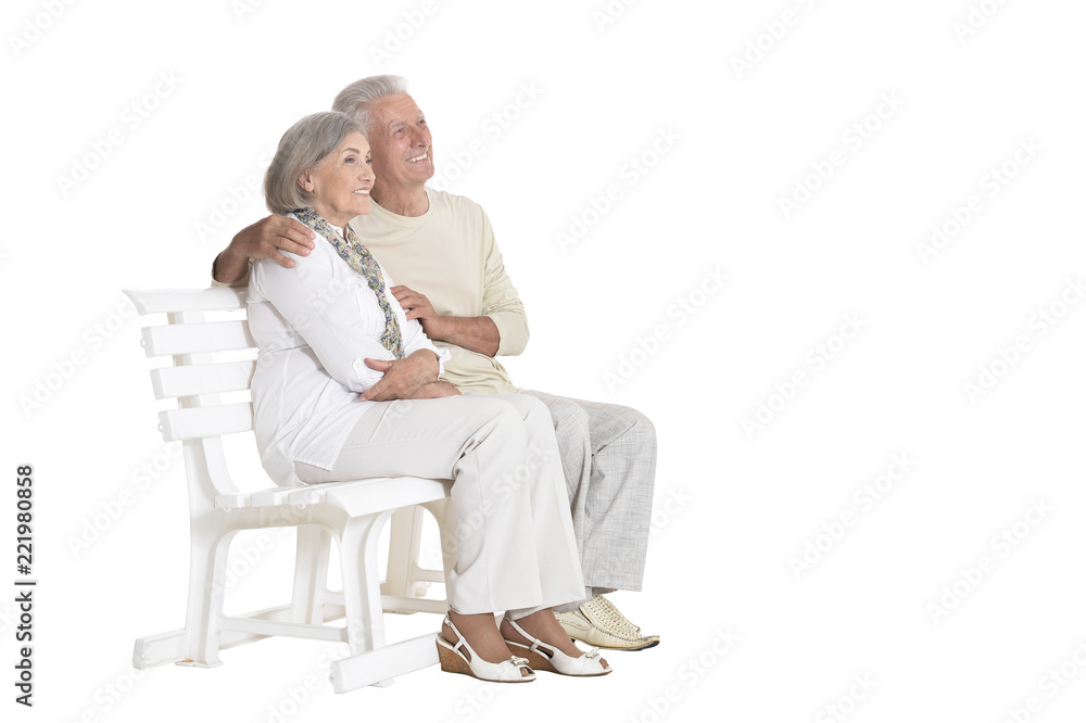 portrait of senior couple sitting on bench portrait of senior couple sitting on bench