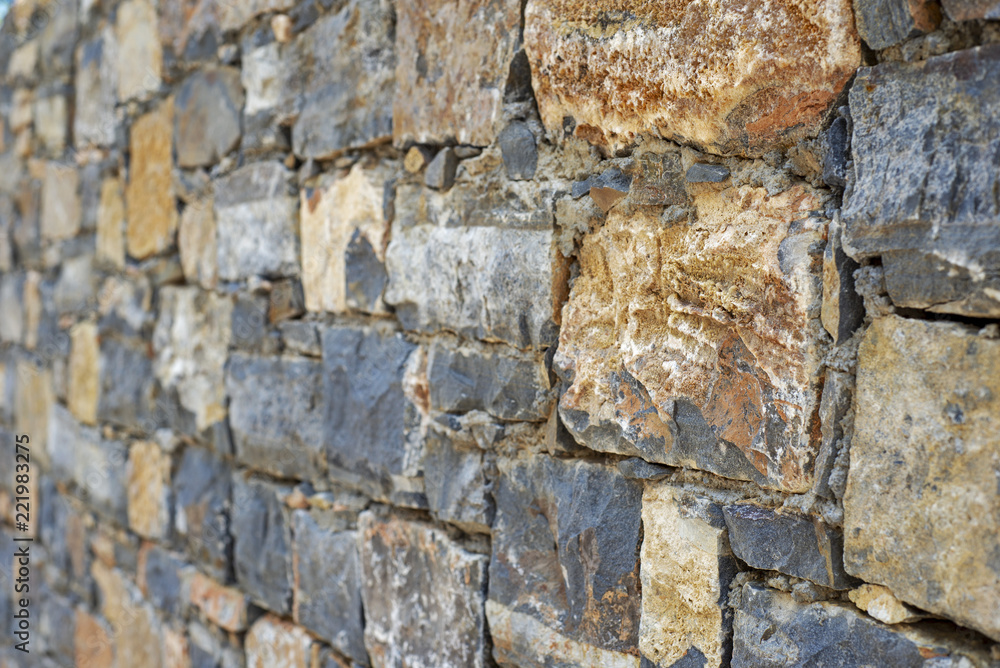 Part of grunge colorful stone blocks wall. Part of grunge colorful stone blocks wall.