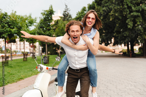 Happy young couple together on motorbike