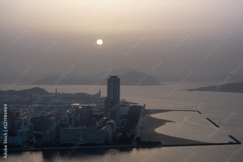 Fototapeta premium View of Kitakyushu City by the sea around Wakamatsu-ku in summer time.