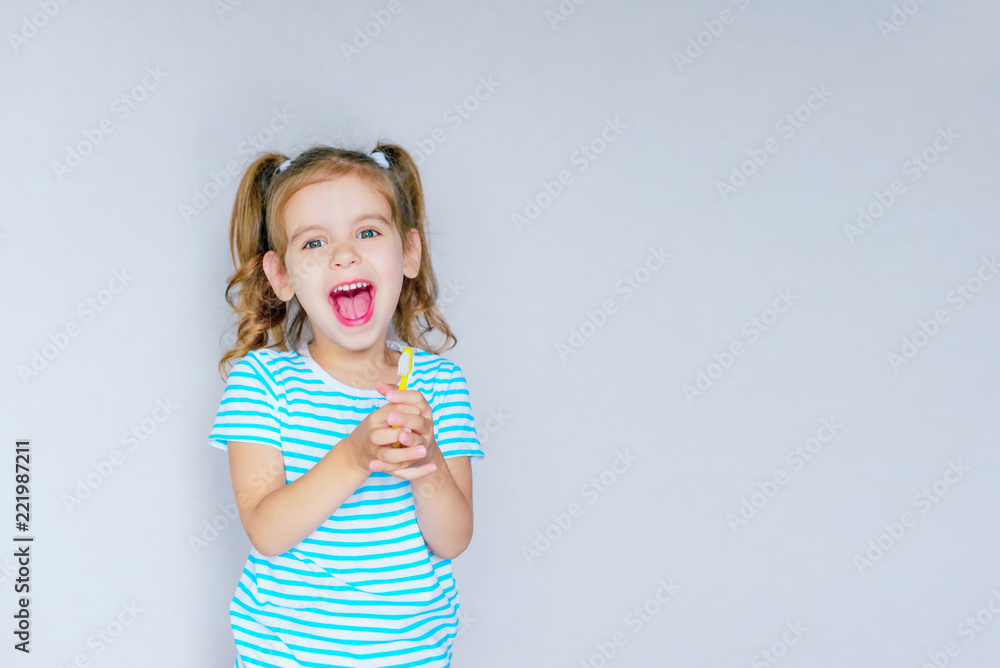 Beautiful baby girl brushing her teeth. Baby girl brushing her teeth and singing a favorite song. Health care, dental hygiene, people and beauty concept. Mockup, free spase. Selective focus. Beautiful baby girl brushing her teeth. Baby girl brushing her teeth and singing a favorite song. Health care, dental hygiene, people and beauty concept. Mockup, free spase. Selective focus.