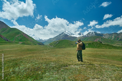 caucasian man with backpacks View from p Pamir