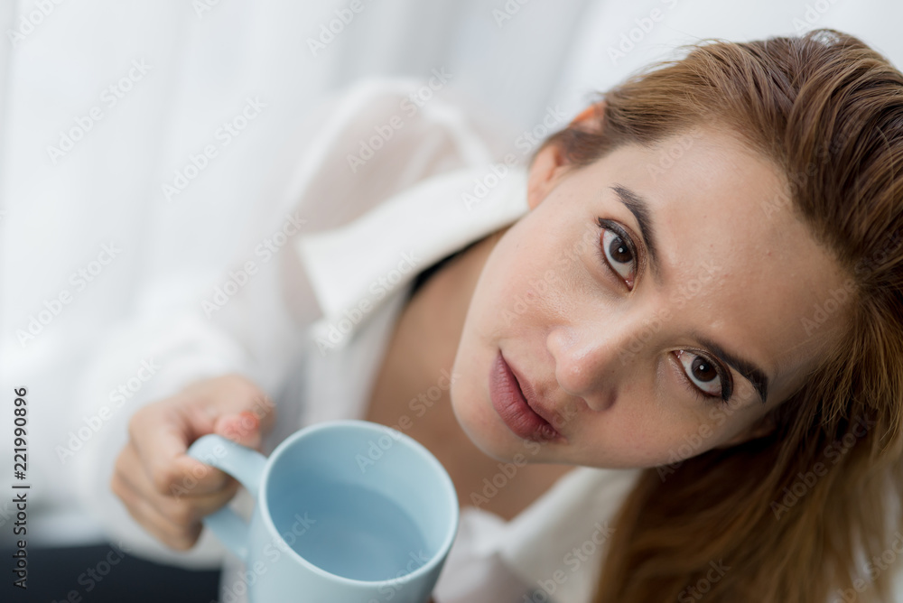 Happy Asian woman drinking coffee and looking out window, lifestyle concept. Happy Asian woman drinking coffee and looking out window, lifestyle concept.