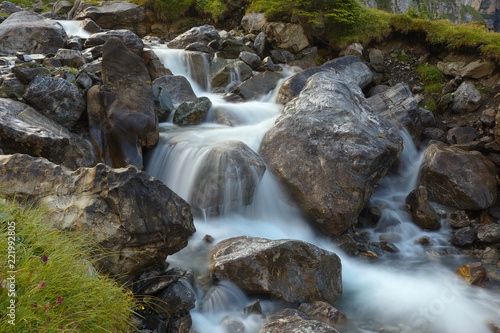 Mountain brook with flowing water on the stones  long exposition