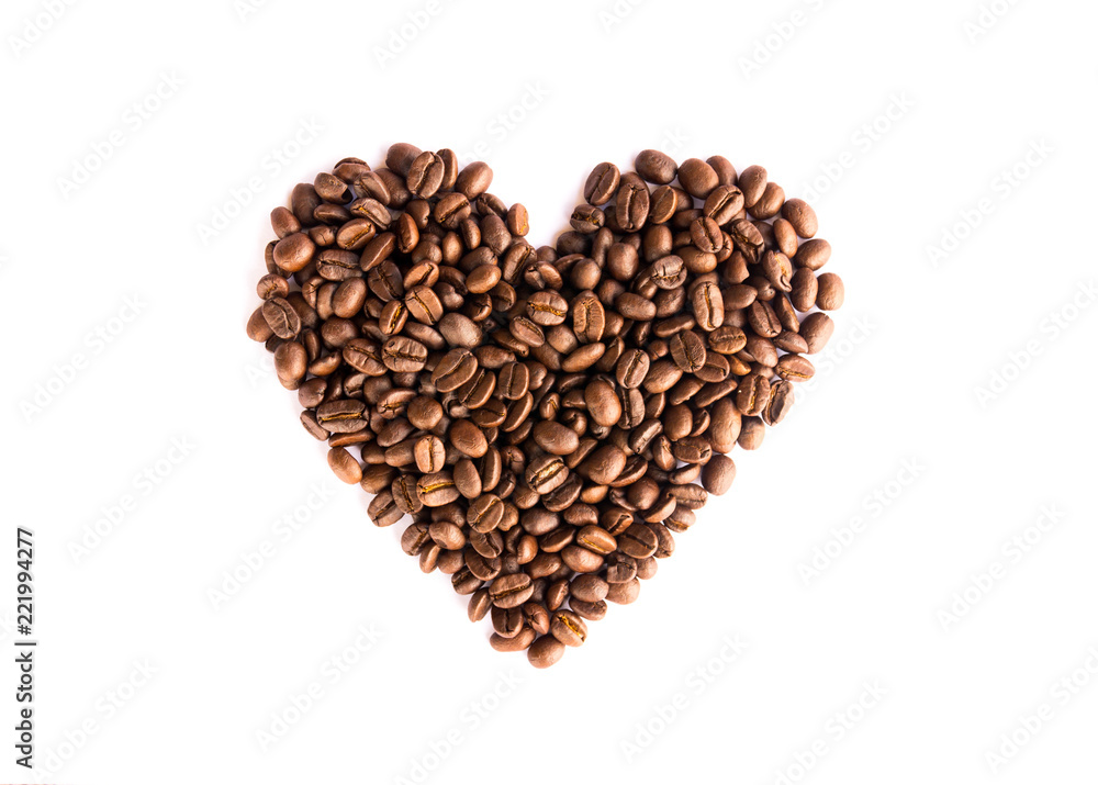 Coffee beans arranged as a heart shape on white background Coffee beans arranged as a heart shape on white background