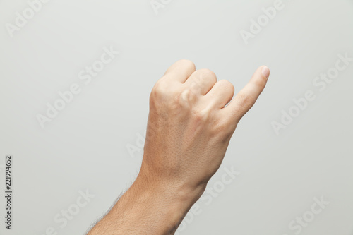 Male hand doing promise gesture, pinky swear