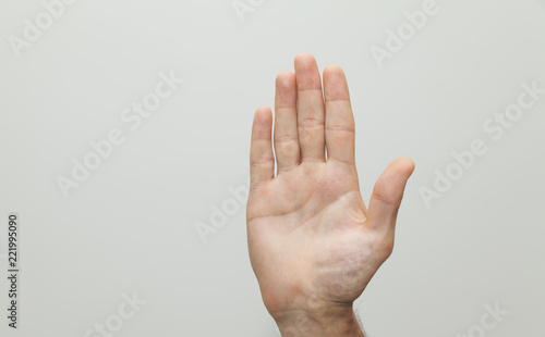 Male hand showing stop sign, gesture