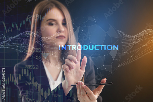 The concept of business, technology, the Internet and the network. A young entrepreneur working on a virtual screen of the future and sees the inscription: introduction