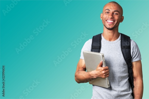 Male student with  backpack on  background