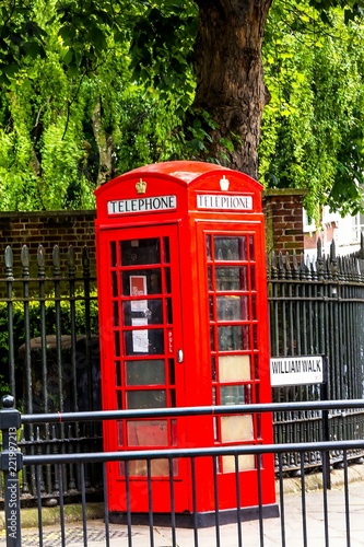 Traditional red English telephone booth at King William Walk street. Greenwich. UK © flik47