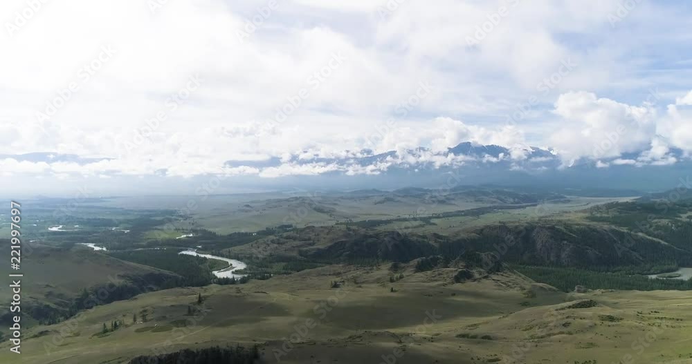 Aerial View. Flying over the beautiful mountain River and beautiful forest. Aerial camera shot. Altai, Siberia. Aerial View. Flying over the beautiful mountain River and beautiful forest. Aerial camera shot. Altai, Siberia.