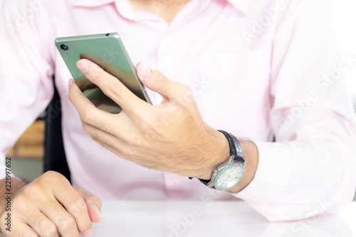 Man using smartphone ,He is talking to work