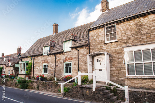 Charming streets of old English traditional stone cottage. Selective focus, copy space. photo