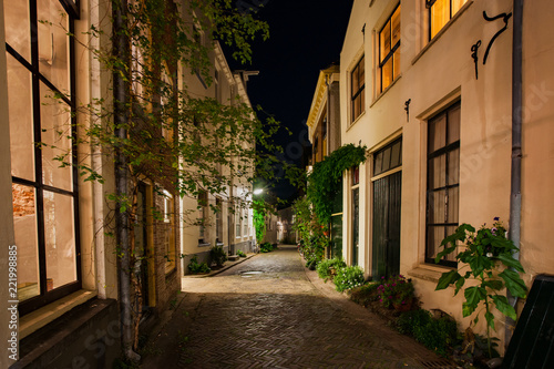 Atmospheric winding street in a characteristic medieval town with monumental medieval houses. Historic old fortified town in the Netherlands along the river IJssel in the province of Gelderland