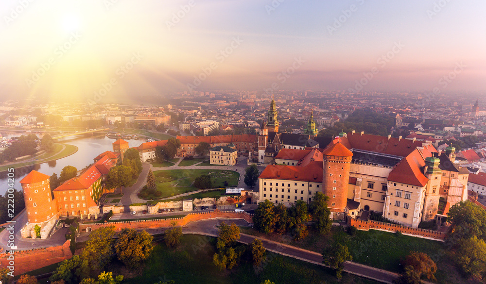 Fototapeta premium Aerial view Royal Wawel Castle and Gothic Cathedral in Cracow, Poland, with Renaissance Sigismund Chapel with golden dome, fortified walls, yard, park and tourists.