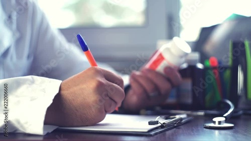 Doctor man hands writing rx prescription