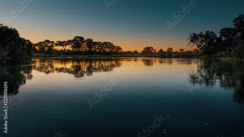 Obraz Zmierzch w Okavango, Namibia