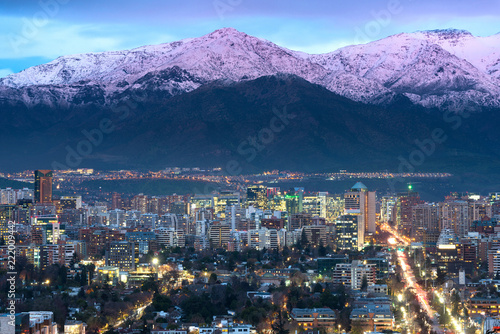 View of residential and office buildings at the wealthy district of Las Condes in Santiago de Chile with Los Andes Mountain Range in the back.