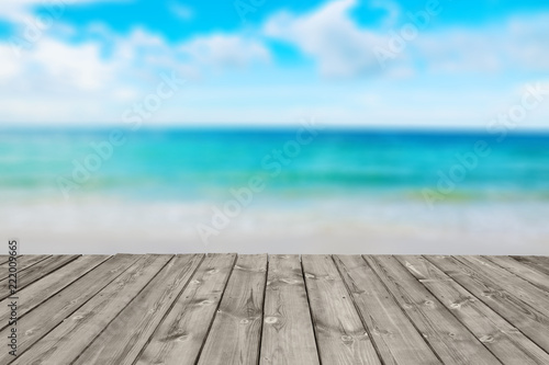blurred tropical beach with sea sky and sunlight