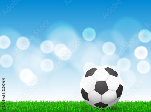 soccer ball on grass with bokeh background