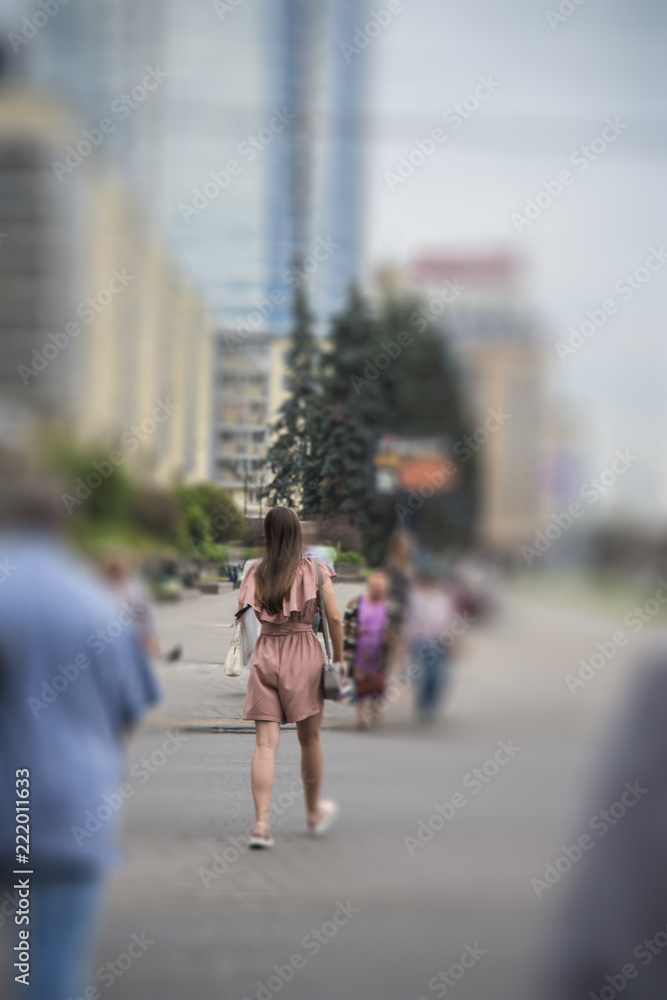 girl crosses the road