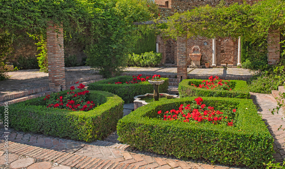 Garden with flowers in the Alcazaba of Malaga, Spain 