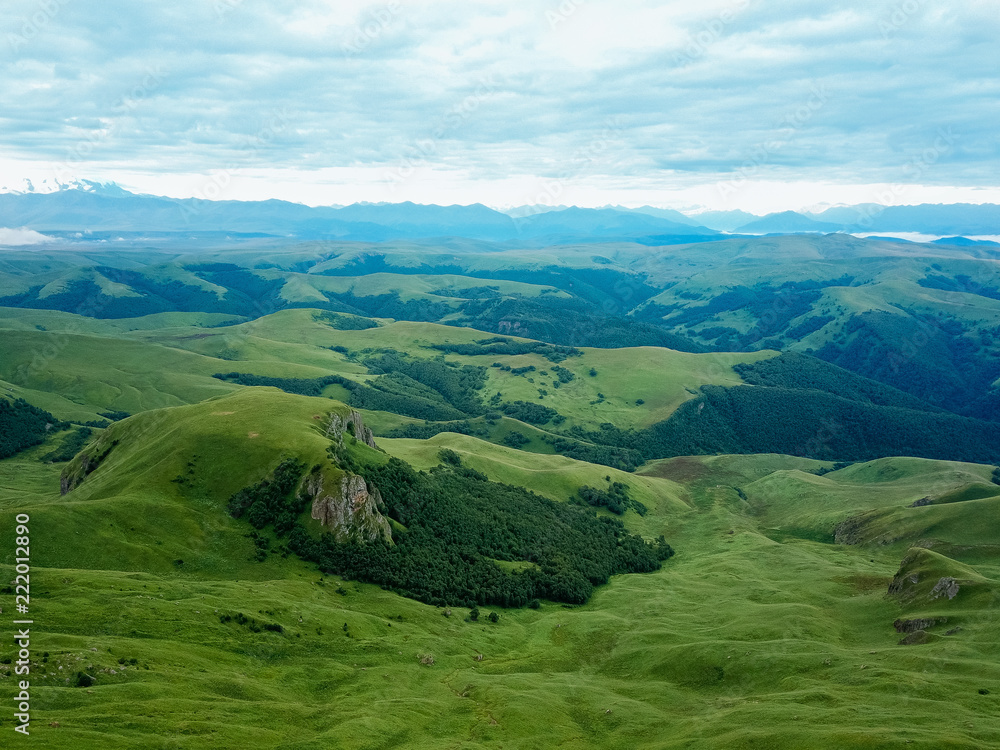 Fototapeta premium View from the drone from the air. The landscape of the valley from a plateau Bermamyt the North Caucasus at sunrise.
