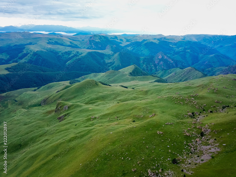 View from the drone from the air. The landscape of the valley from a plateau Bermamyt the North Caucasus at sunrise.